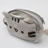 A soft gray plush cat pencil case with a zipper and embroidered features.