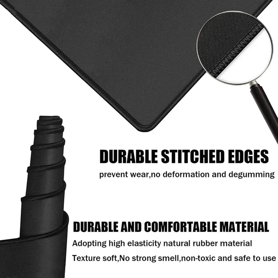 Black mouse pad with stitched edges and a magnifying lens showing the durable material texture