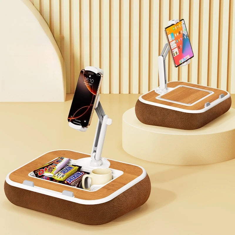 A wooden phone and tablet stand with a rotating mount holding a smartphone and a tablet.