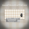 Beige plaid pattern non-slip mouse pad with a laptop and keyboard shown on a light background.
