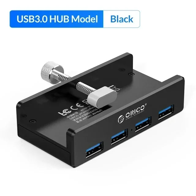 A black USB 3.0 hub with multiple ports and a clip is shown from above.