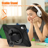 A woman is using a universal shockproof silicone case for an iPad on a table.