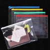 A set of nine transparent plastic document file organizer bags in various colors stacked horizontally.