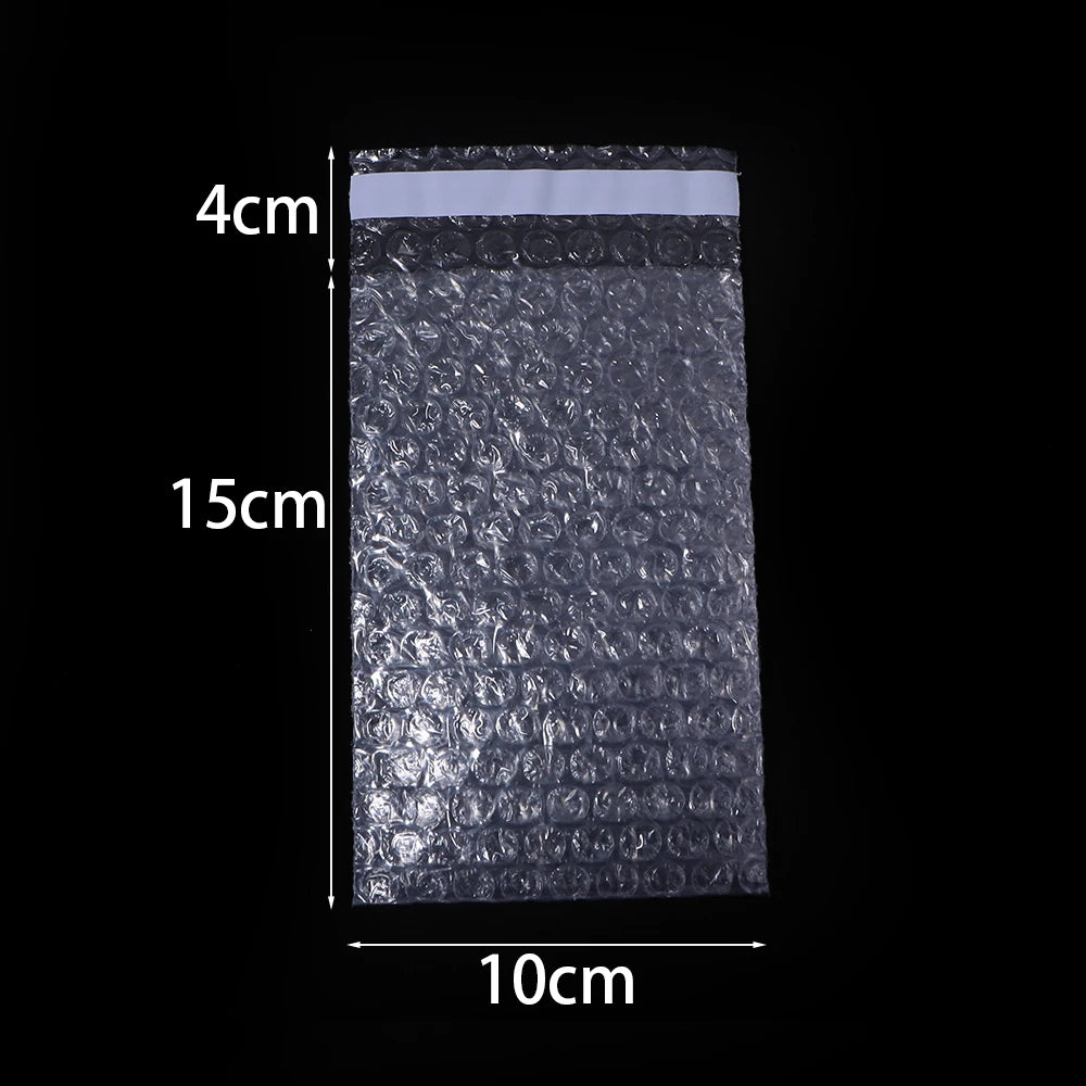 Rechteckiger, durchsichtiger Plastik-Blasen-Mailer mit Maßen 4x15cm und einer Breite von 10cm.