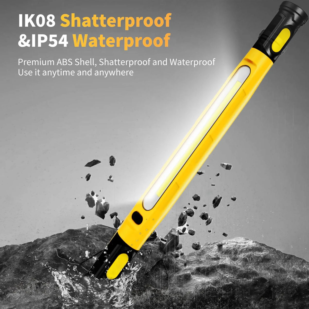 A yellow magnetic rechargeable LED work light is shown illuminating a rocky surface.