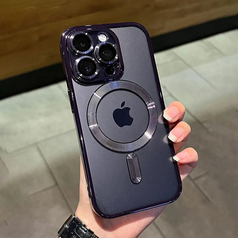 A hand holds a dark purple magnetic clear case with a silver finish for a MagSafe iPhone.