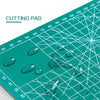 A green cutting pad with various clear, glossy blobs and markings visible on the surface.