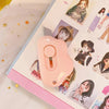 A pink adorable cat paw mini cutter tool is shown on a page of craft or mail items.