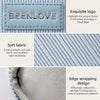 A light blue fabric laptop sleeve featuring a silver BEENLOVE logo and an edge wrapping design.