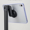 A purple phone or tablet is held in place by a black magnetic stand attached to a silver pole.