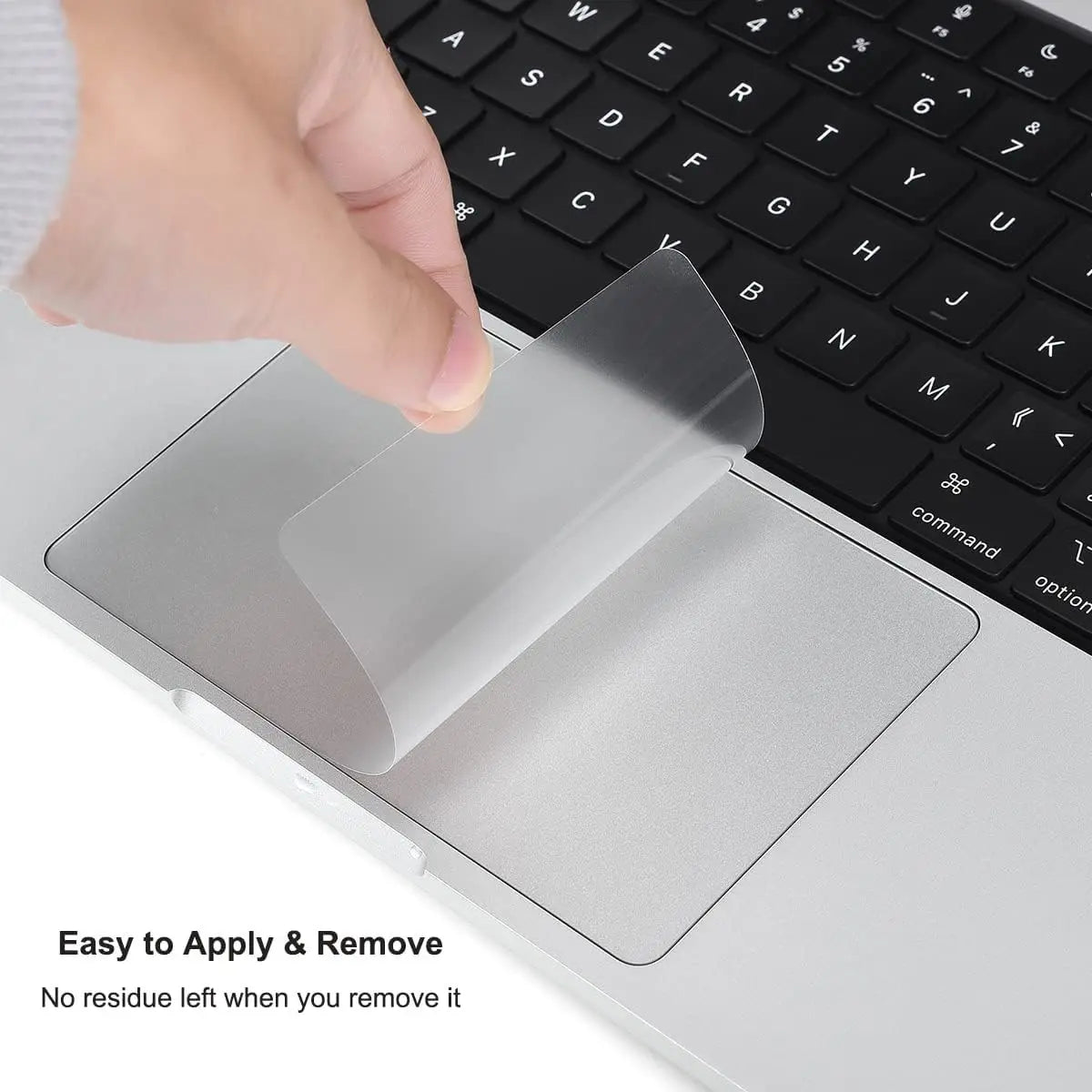 A hand is applying a clear trackpad protector film to a laptop touchpad for easy application and removal.