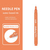An orange needle pen with a gold cap and a black tip, labeled 0.03.