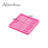 A pink silicone resin mold with a rectangular shape and a small indentation, shown from above.