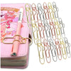 A set of elegant gold-colored metal pen clips designed for holding notebooks and journals.