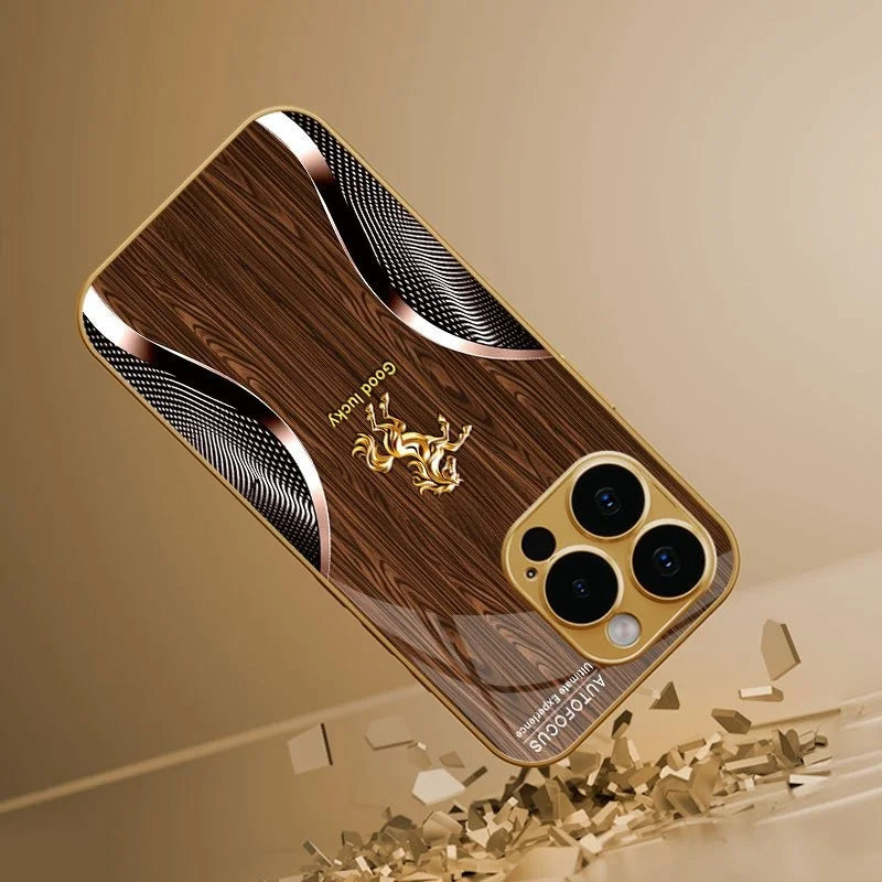 A brown wood grain phone case with a gold horse design and a clear back, shown diagonally.