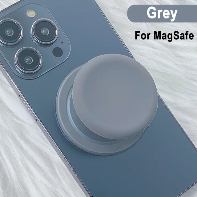 A grey phone case with a silicone magnetic grip cover shown on a light surface.