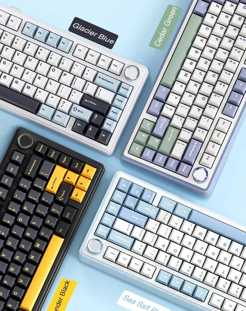A collection of various mechanical keyboards in Glacier Blue, Cedar Green, and blue tones shown from above.