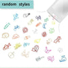 A collection of colorful decorative bookmarks and paper clips scattered on a white background.