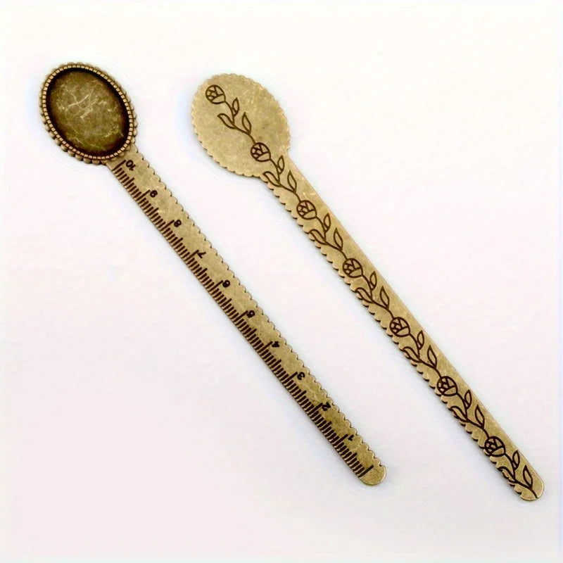 Vintage brass straight ruler with a leaf pattern design and a round measuring spoon.