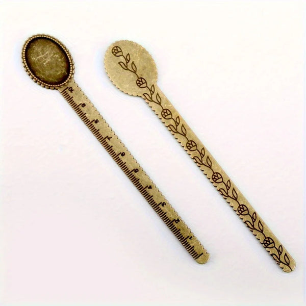 Vintage brass straight ruler with a leaf pattern design and a round measuring spoon.