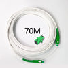 A coil of 70 meter single-mode fiber optic cable with green connectors is shown on a white background.