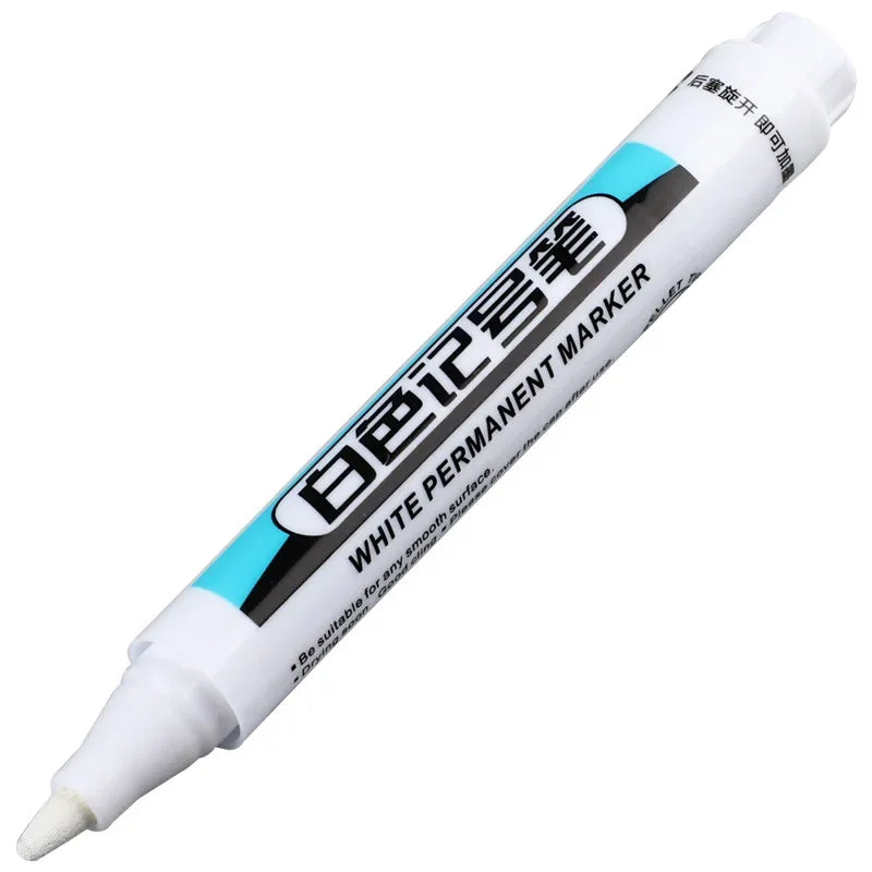 A white permanent paint marker pen with black text on a white background.