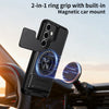 A black phone case with a camera cover and built-in magnetic car mount is shown in a car interior setting.