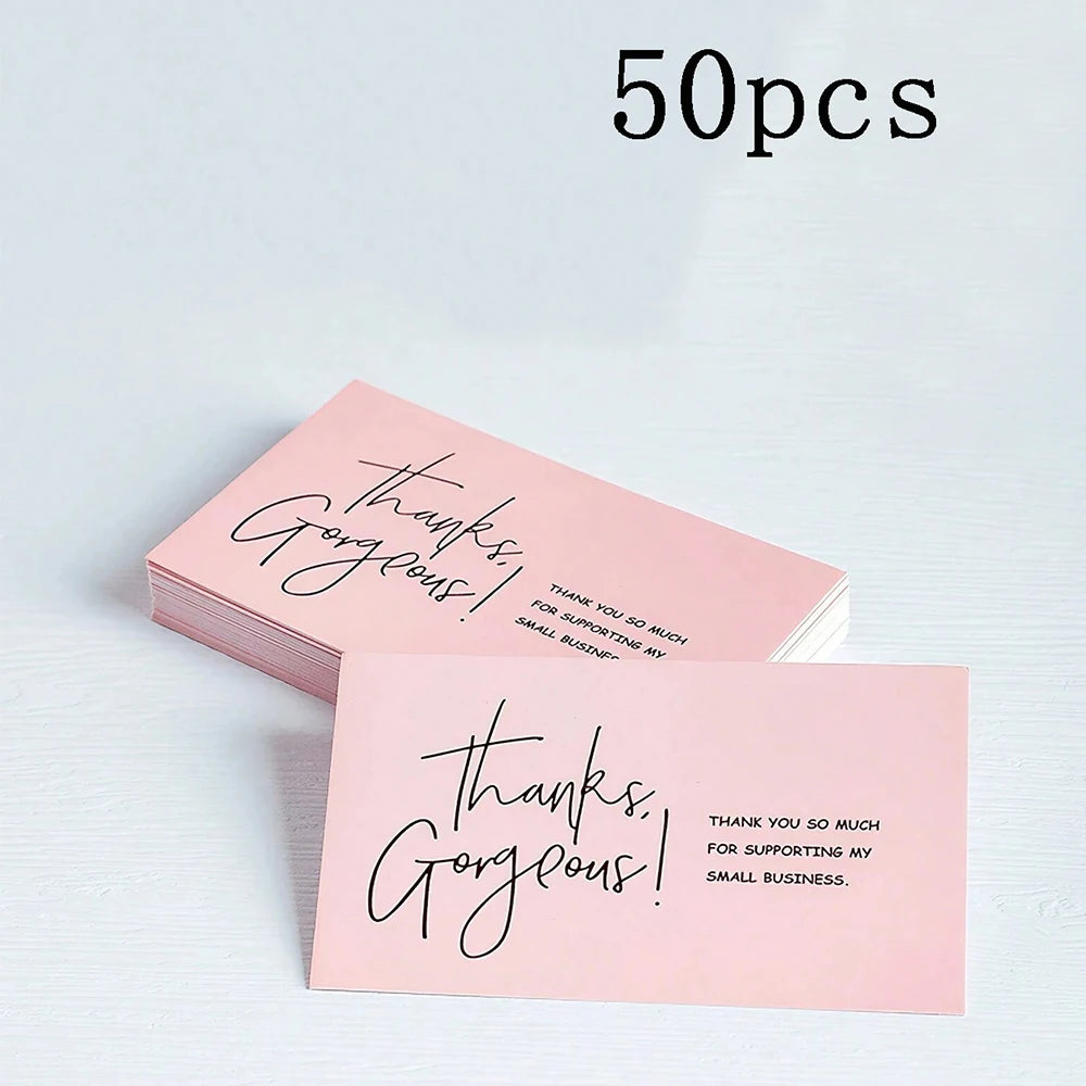 A stack of 50 pink thank you cards with black script reading Thanks Gorgeous for supporting my small business.