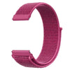 A close-up view of a pink nylon loop watch strap for a child.