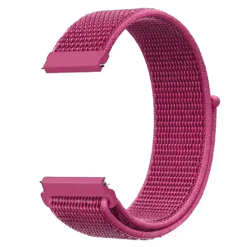 A close-up view of a pink nylon loop watch strap for a child.
