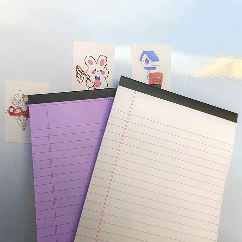 A purple tearable lined writing pad is displayed next to two small cards featuring cute animal and house illustrations.