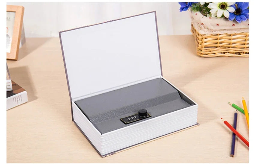 A silver and white mini secret cash storage box with a lid open, resting on a light wooden surface.