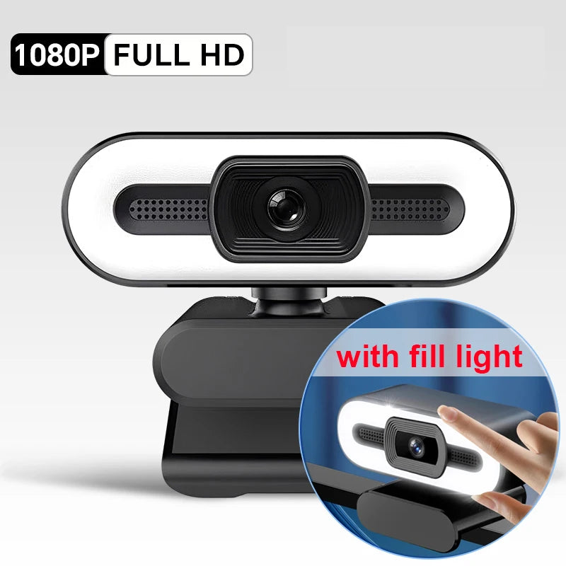 A black webcam with a built-in fill light and microphone is shown on a stand.