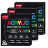 A set of black acrylic brush markers with various tips and colors packaged in a box.