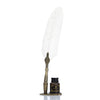 A vintage feather dip pen set featuring a white feather and gold accents displayed on a small box.