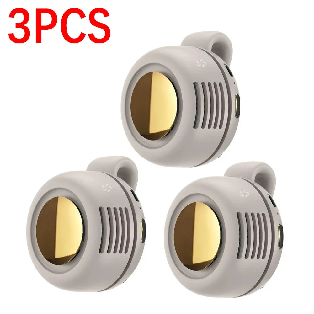 Three portable mini blade-less electric fans in a light gray color shown from above.