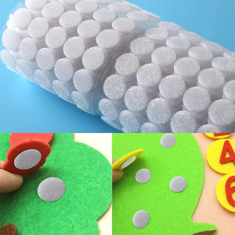 Roll of white hook and loop fasteners with individual adhesive hooks visible on a green surface.