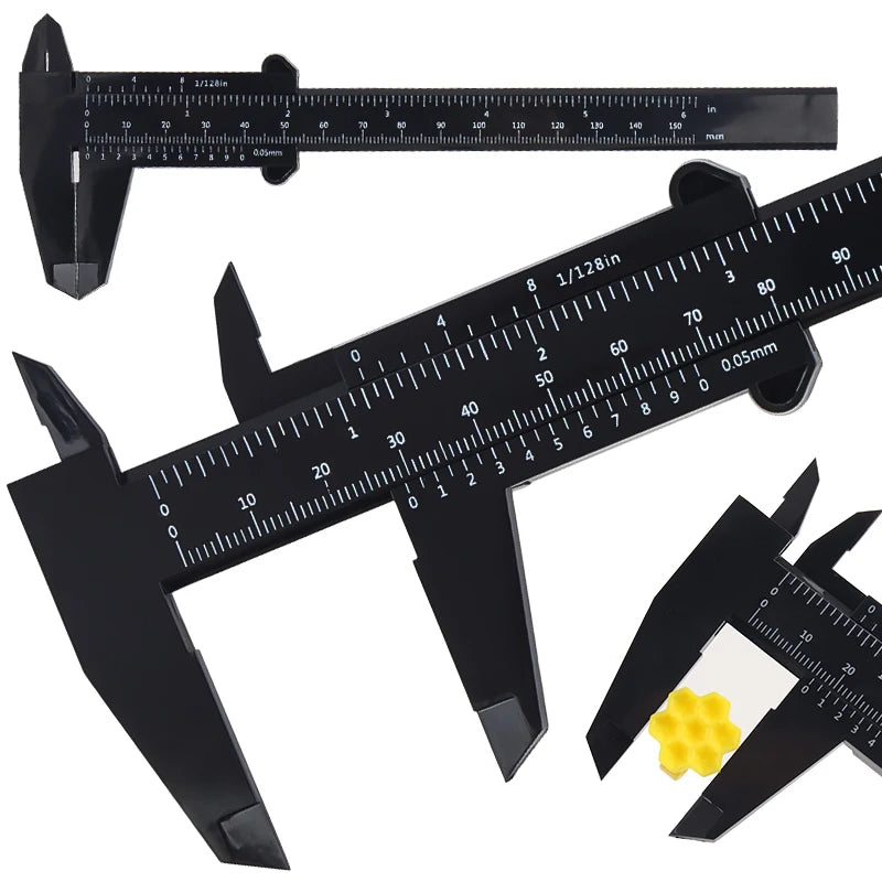 A black precision eyebrow measuring caliper with a ruler scale and yellow pom-pom for permanent makeup application.