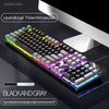 A black and gray mechanical keyboard with double glow features is shown on a desk.