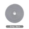 A roll of grey reusable hook and loop cable ties, packaged in three pieces.
