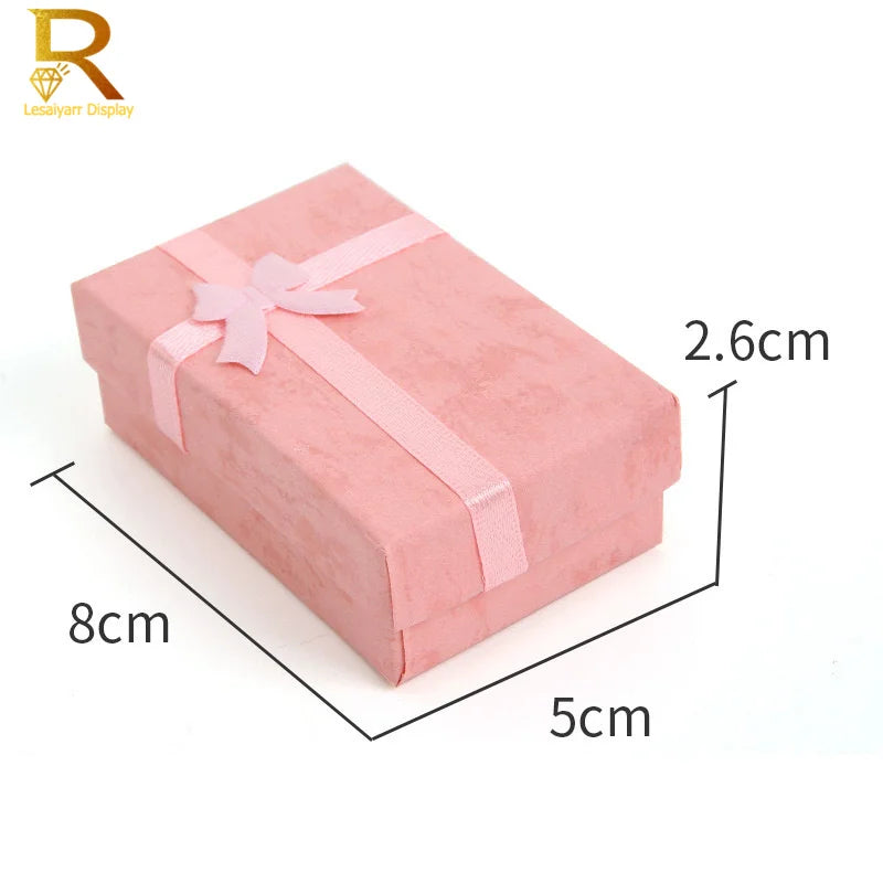 Pink velvet jewelry gift box with a pink ribbon, measuring 5cm by 8cm and 2.6cm high.