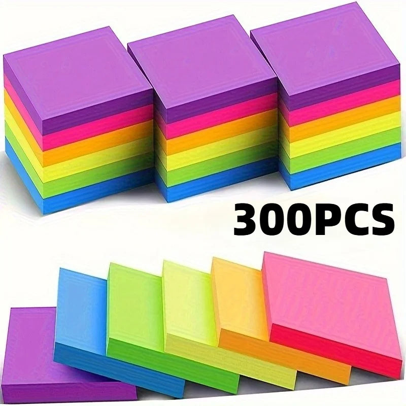 A stack of vibrant neon colored sticky notes in various shades including purple, pink, yellow, green, and blue.