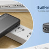 A portable charger with a built-in Type-C cable and wall plug shown on a wooden surface.