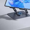 A dark gray tablet stand holding a tablet displaying a blue floral design.