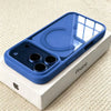 A blue transparent acrylic phone case with multiple camera cutouts is shown resting on its white packaging box.