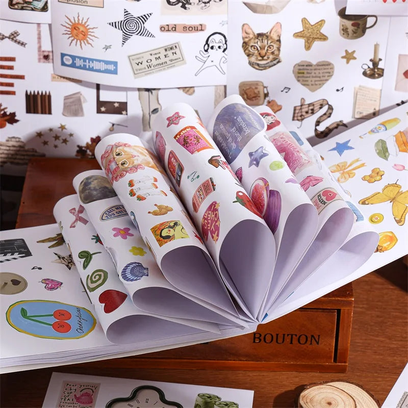 A collection of aesthetic scrapbooking stickers featuring nature and animal patterns displayed in an open book.
