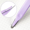 A close-up view of a purple magnetic staple remover tool set on a white grid background.