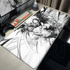 An oversized mouse pad featuring a detailed black and white illustration of a fierce wolf head.