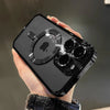 A hand holds a black magnetic clear case with a plated finish for a MagSafe iPhone.