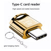 A gold-colored Type-C card reader device with a detachable connector and hanging chains.
